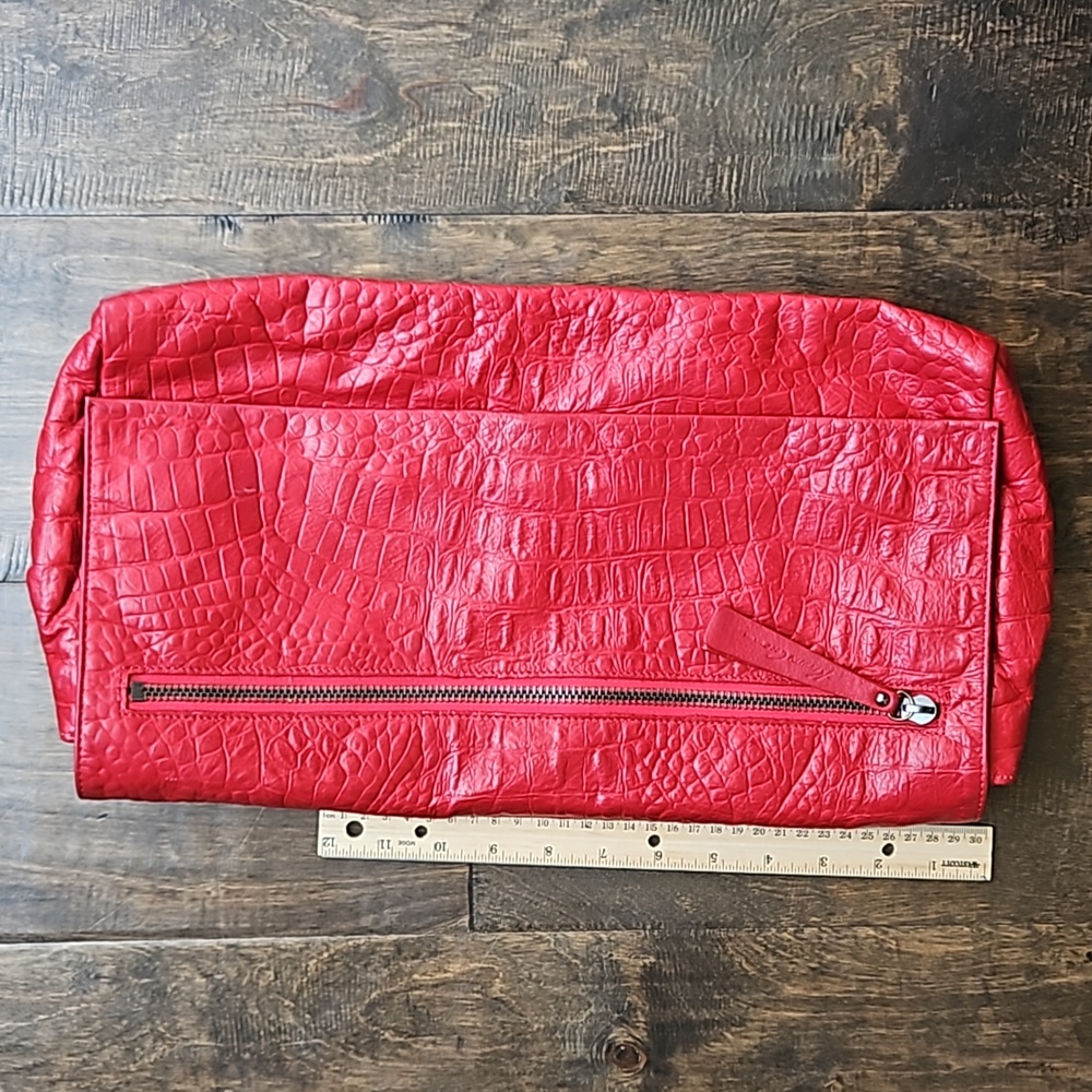 Red embossed leather Kenneth Cole clutch